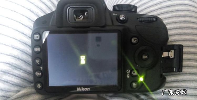 d3200怎么开机,佳能相机在哪里开机